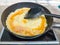 Cooking omelet in pan