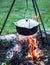 Cooking in the open-air. Cauldron over the campfire