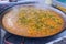 Cooking paella typical from Valencia Spain rice
