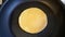 Cooking pancake in a pan. Maslenitsa.