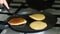 Cooking pancakes on frying pan