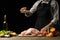 Cooking Peking Duck chef with fruit, on a black background. Horizontal photo, space for menu and design, restaurants, hotel