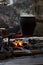 Cooking pot on blacksmith\'s fireplace