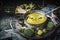 Cooking pot with green romanesco and broccoli soup and ladle on dark rustic kitchen table . Healthy food and diet nutrition