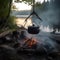 cooking pot hanging above camp fire riverside