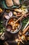 Cooking pot with wooden spoon and vegetables on rustic kitchen table background. Homemade healthy food and eating