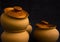 Cooking pots on a dark background