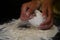 The cooking process of a bread dough. Baking bread recipe. Bakery breads food, detail view with woman hands working.