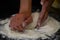 The cooking process of a bread dough. Baking bread recipe. Bakery breads food, detail view with woman hands working.