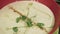 Cooking process and serving mushroom cream soup in a bowl. Eating healthy vegetarian dinner.