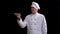 Cooking, profession and people concept - happy male chef cook holding rolling pin