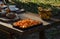 Cooking pumpkin pie, soup and table setting in the garden on the background of homemade bread with  seeds and decorative pu