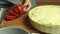 Cooking quiche recipe and cutting tomato