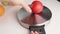 cooking a recipe with the exact weight of the ingredients, tomato on a kitchen scales