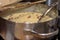 Cooking Rice with Brown Pinto Beans in Silver Saucepan