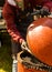 Cooking sausages in a large orange grill at a fair