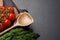 Cooking scene: Cherry tomatoes, herbs and spices on table