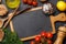 Cooking scene: Cherry tomatoes, pasta, spices on table