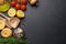 Cooking scene: Cherry tomatoes, pasta, spices on table