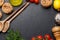 Cooking scene: Cherry tomatoes, pasta, spices on table