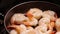 Cooking shrimp on pan with steam in slow motion