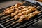 Cooking souvlaki on grill