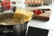 Cooking spaghetti in pot on electric stove, closeup.