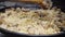 Cooking spanish paella, Stiring rice