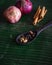 Cooking spices on banana leaf. Cardamom, star anise, cinnamon and onions. Buah pelaga, bunga lawang, kayu manis and bawang besar