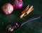 Cooking spices on banana leaf. Cardamom, star anise, cinnamon and onions. Buah pelaga, bunga lawang, kayu manis and bawang besar