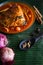 Cooking spices on banana leaf. Cardamom and star anise on a wooden spatula. Buah pelaga, bunga lawang, Selective focus