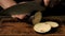 Cooking Squash. Chief\'s Hands Cutting Eggplant. Close - Up Shot