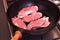 Cooking steaks at home. Fry steaks in a frying pan at home.