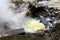 Cooking sweet corn in thermal springs. Travel to Furnas, San Miguel, Azores.