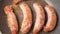 Cooking traditional Bavarian sausages. German pork sausages