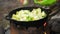 Cooking of vegetables in cauldron outdoors