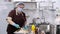 Cooking. woman chef, in protective gloves and a mask, prepares food in the kitchen, in canteen. health food and safety