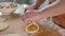 Cooking. Woman preparing pies with stuffing on a wooden board