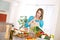 Cooking - Woman reading cookbook in kitchen