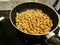 Cooking - Yellow beans are fried in a frying pan