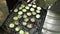 Cooking zucchini vegetables in grill grate. Vegan food. Slow motion handheld