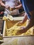 Cooks making dough for Tortillas on a kneading trough