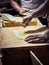 Cooks making Tortillas on a wooden rustic table