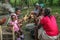 Cooks at a rural parish prepare fresh chicken for a meal during a medical mission to Haiti.