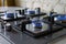 Cooktop with burning gas ring. Gas cooker with blue flames. Tinted photo