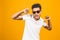 Cool afro american man wearing sunglasses over isolated background, having successful idea. Exited and happy. Number one