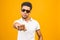 Cool afro american man wearing sunglasses over isolated background, having successful idea. Exited and happy. Number one