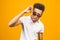 Cool afro american man wearing sunglasses over isolated background, having successful idea. Exited and happy. Number one