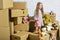 Cool apartments. happy child cardboard box. purchase of new habitation. happy little girl with toy. Cardboard boxes -