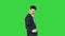 Cool attractive businessman does different defiant gestures on a green screen, chroma key.